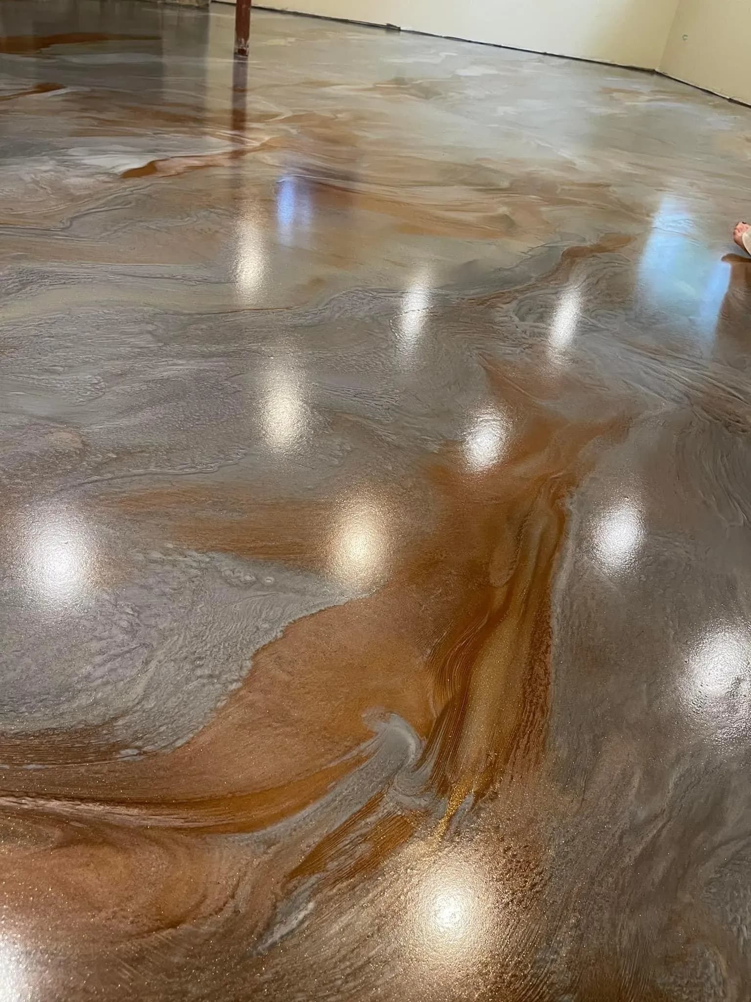 Decorative acid stained concrete flooring for an art coast interior in Saugatuck MI