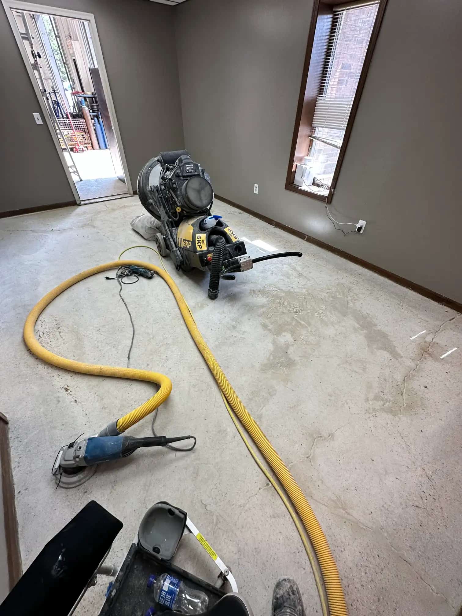 Protective sealer being applied to a concrete surface