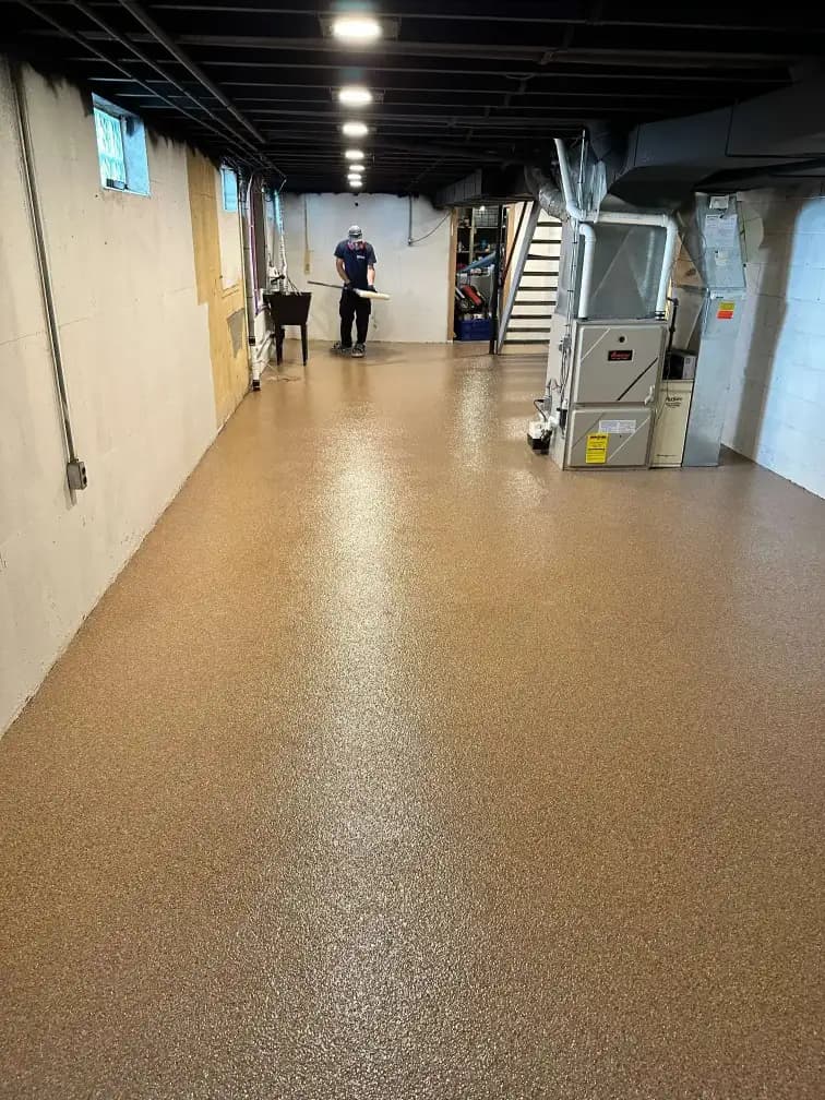Detailed view of a moisture-resistant basement epoxy coating in West Michigan