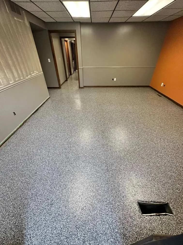UV-stable coated concrete floor with a decorative flake finish