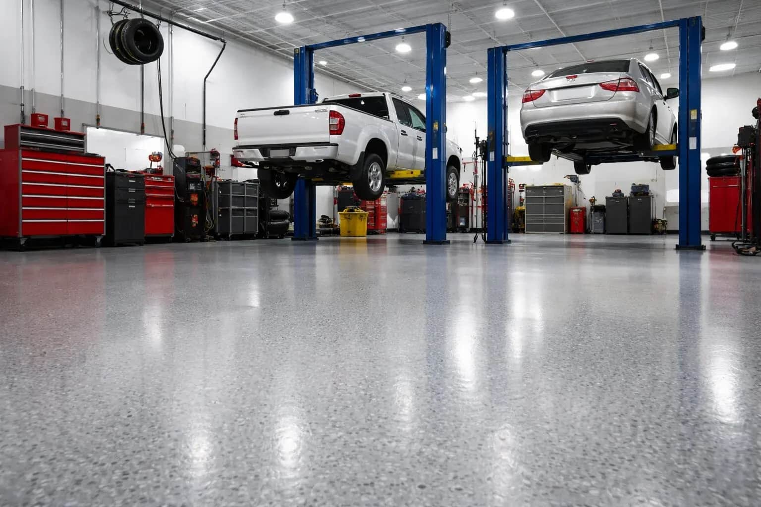 Commercial auto shop floor coating installation