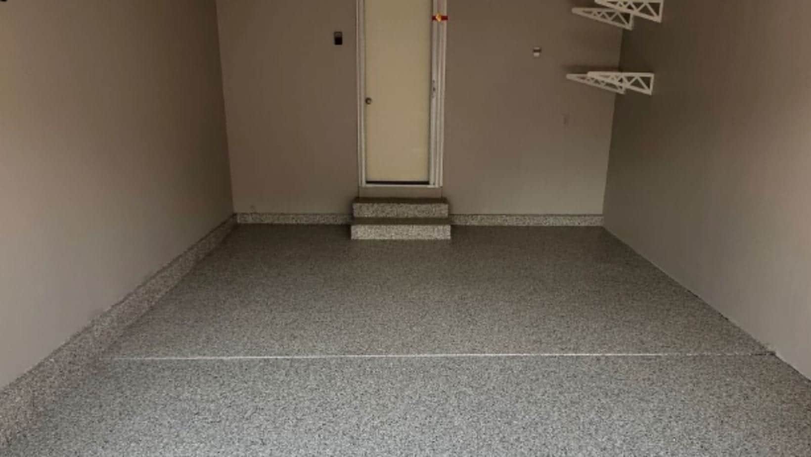 Decorative coating across a finished basement concrete floor