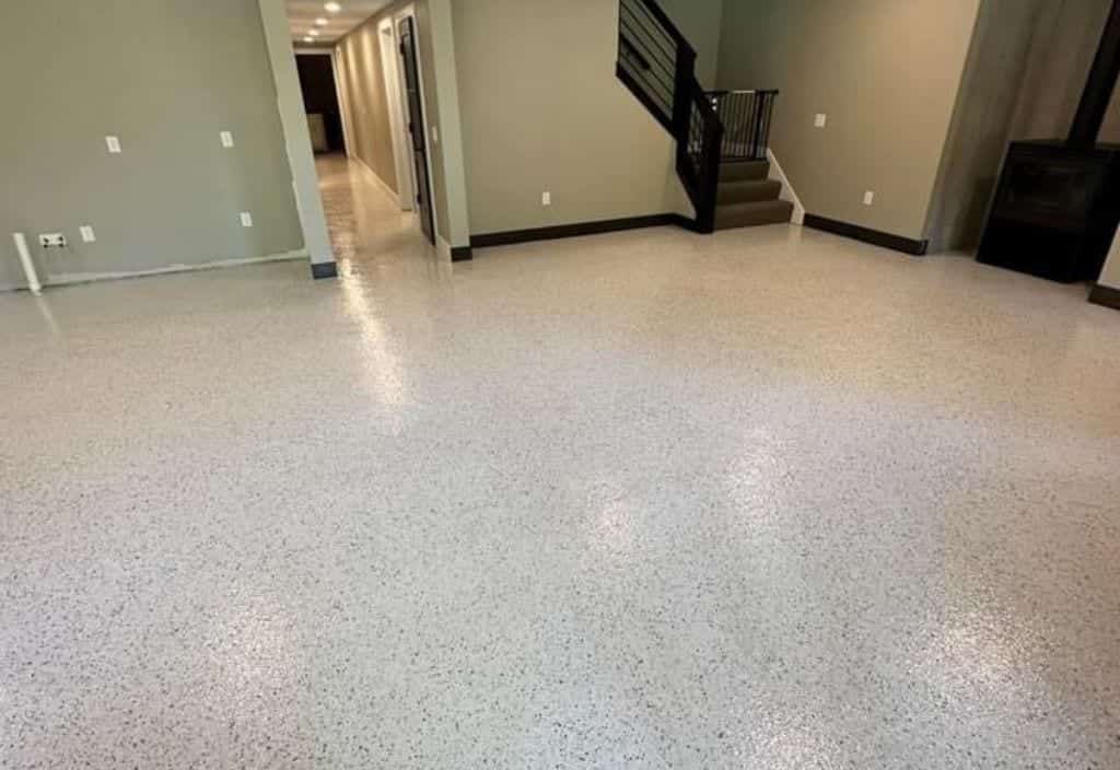 Finished epoxy flake floor across a basement room