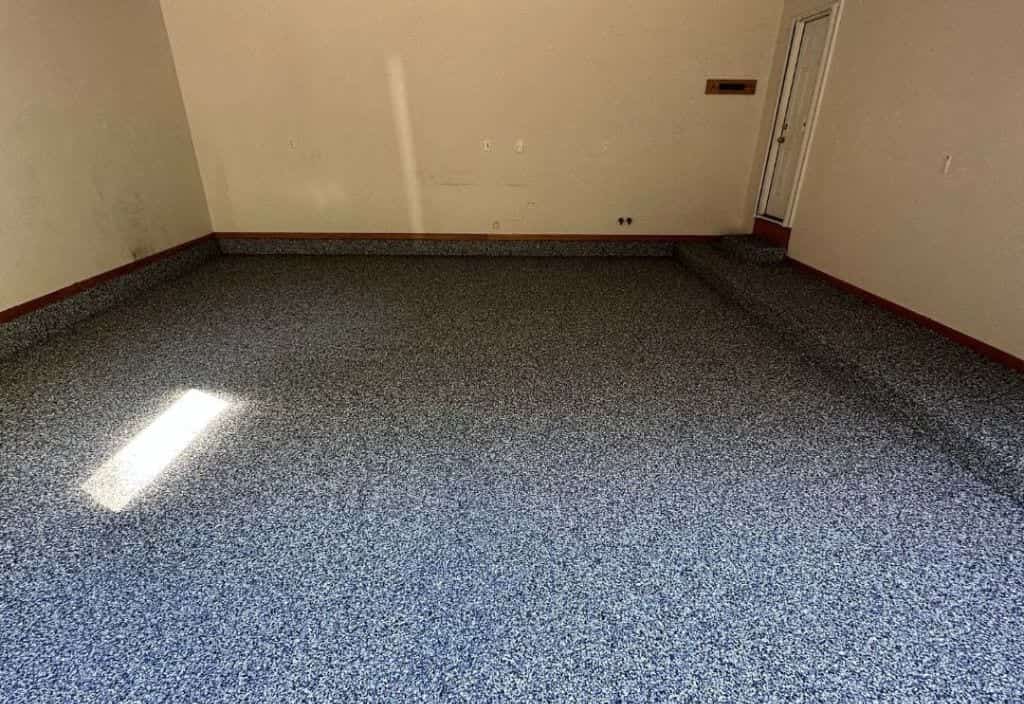 Blue decorative flake finish across a completed concrete floor