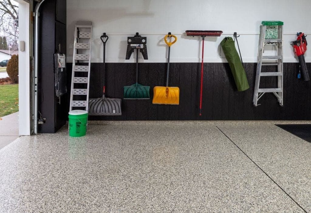 Finished garage flake floor suited to a Hudsonville subdivision home