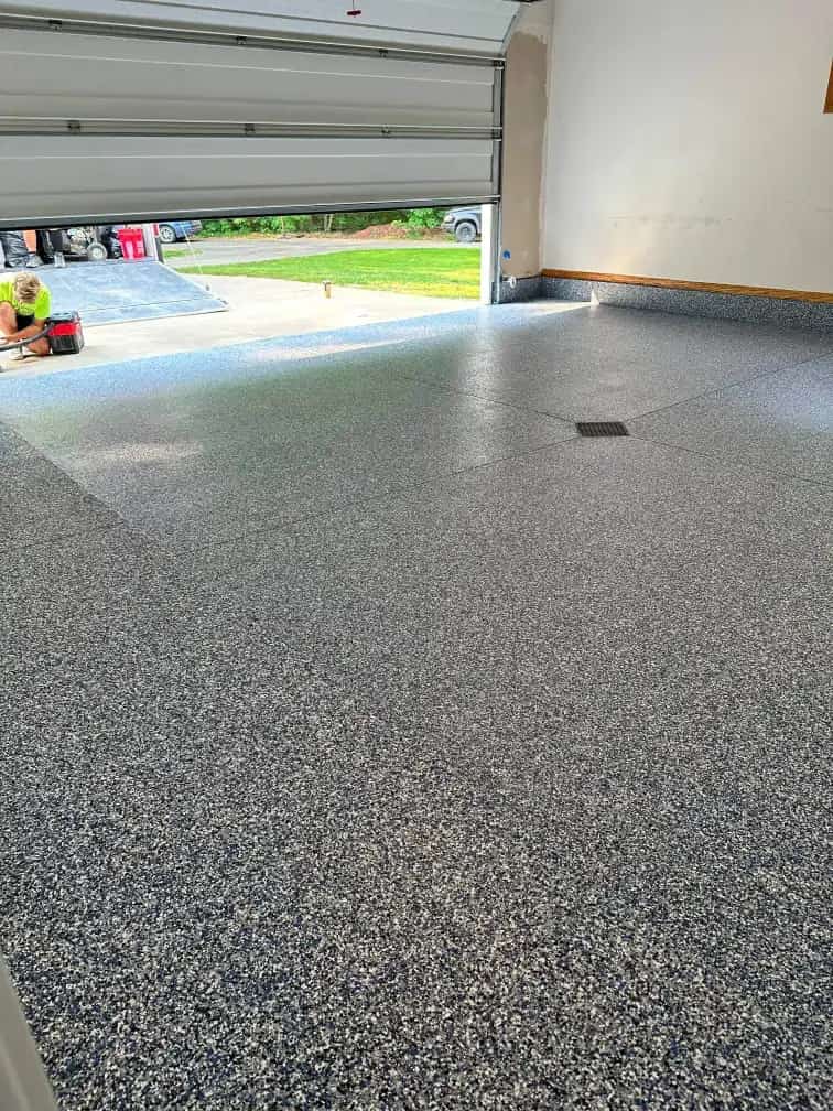 Gray decorative flake coating across a finished garage floor