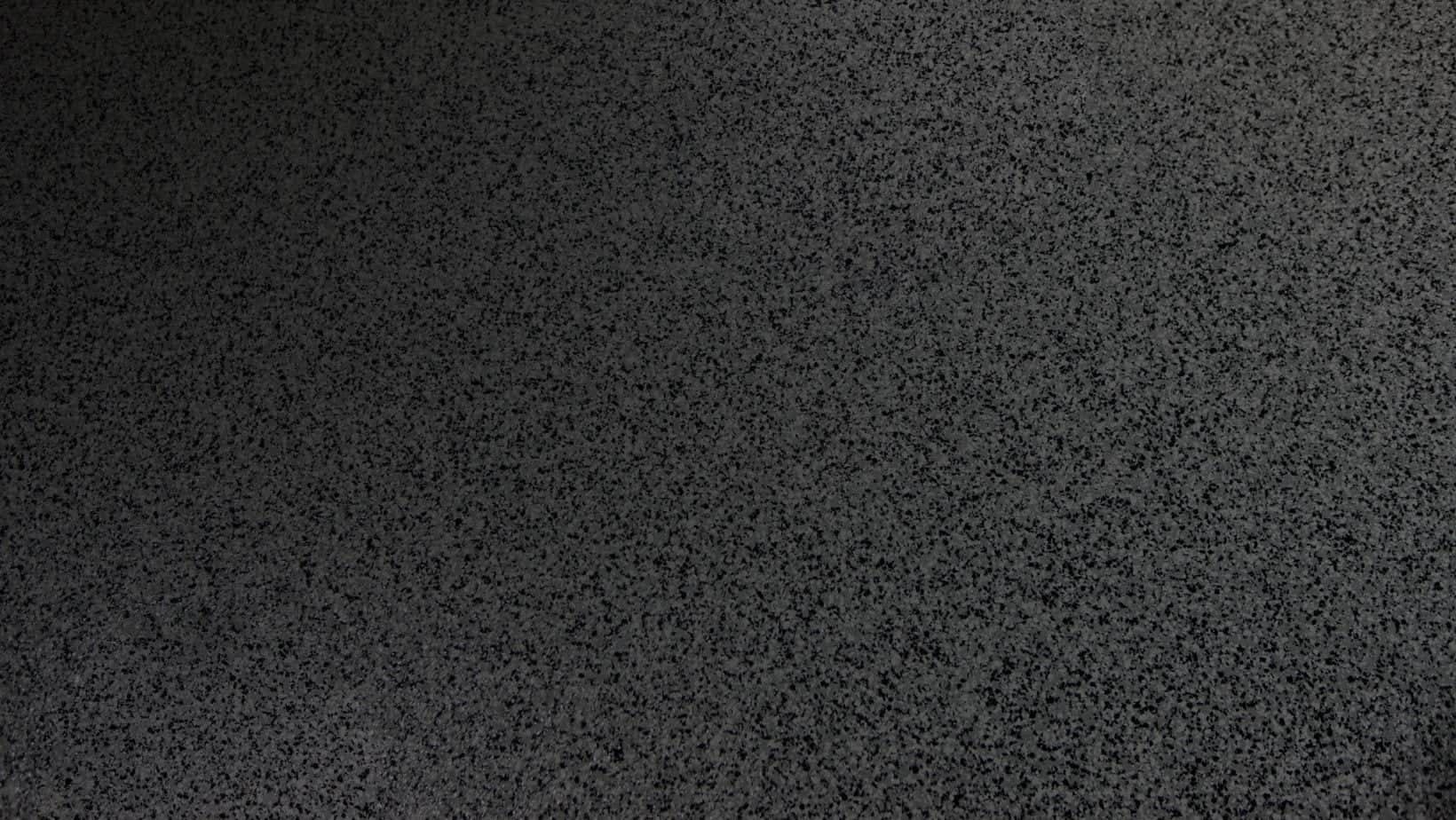 Close view of a dark gray decorative concrete coating texture