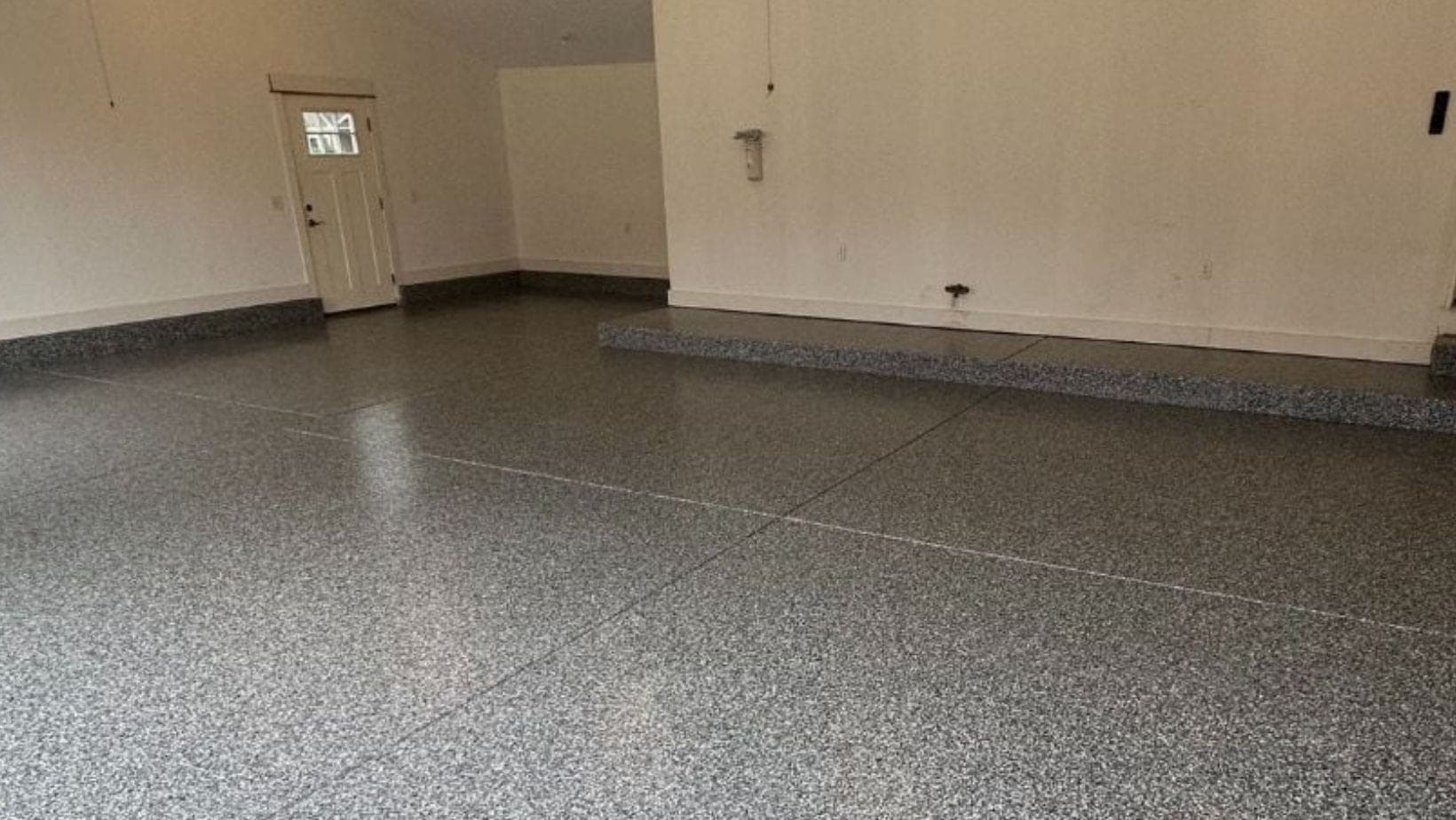 Durable flake floor coating in a finished Dorr MI hobby room