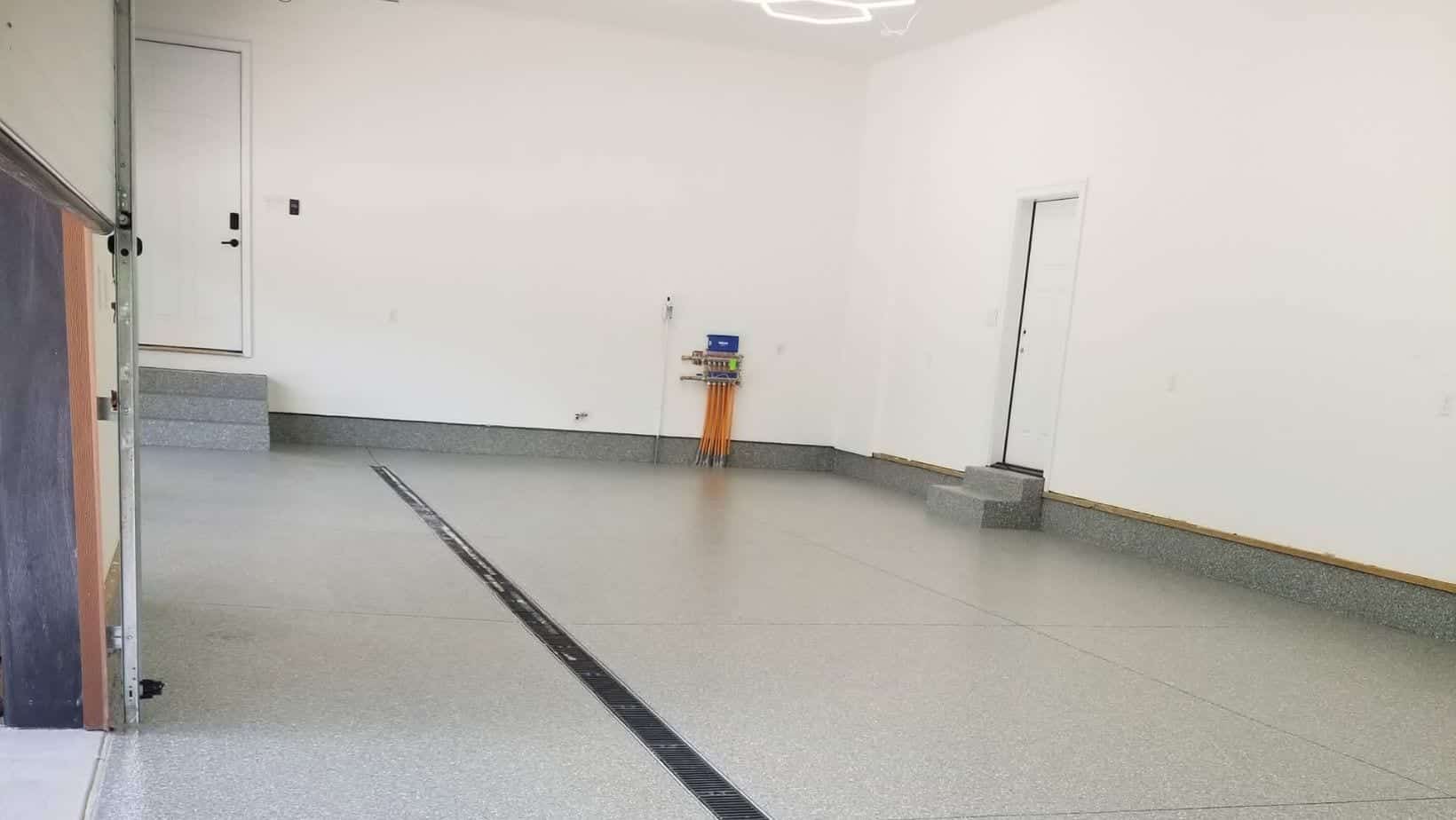 Speckled garage floor coating in a spacious Forest Hills Michigan garage