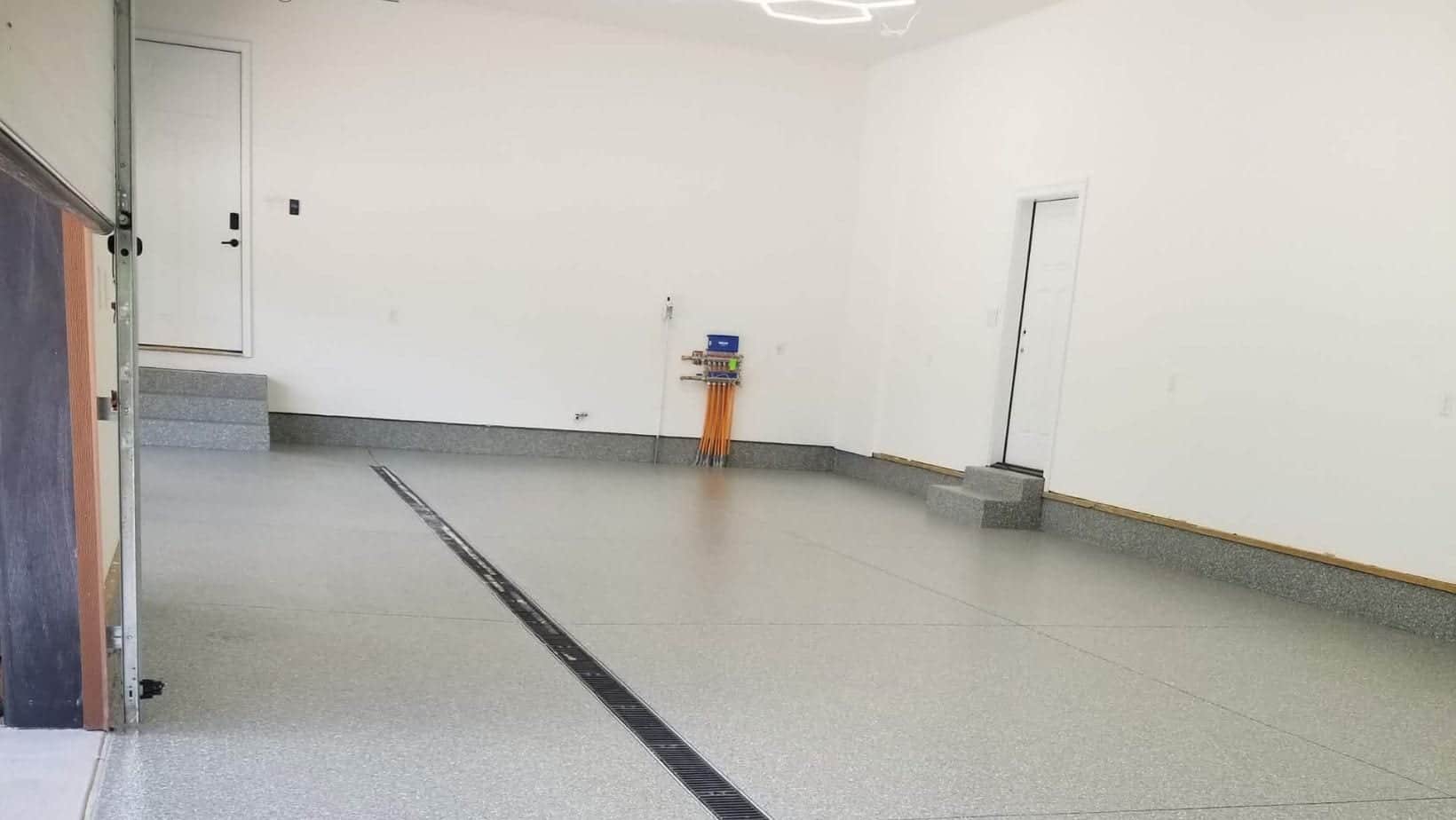 Speckled flake coating covering an oversized finished garage floor