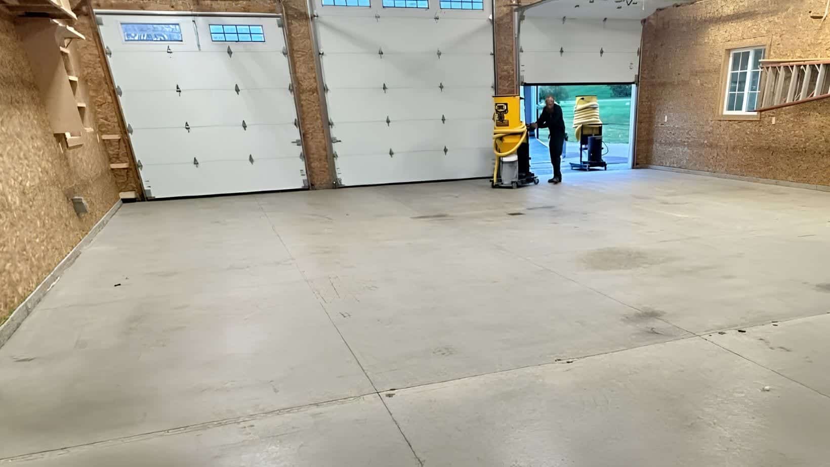Rough concrete slab in a large pole barn style work space