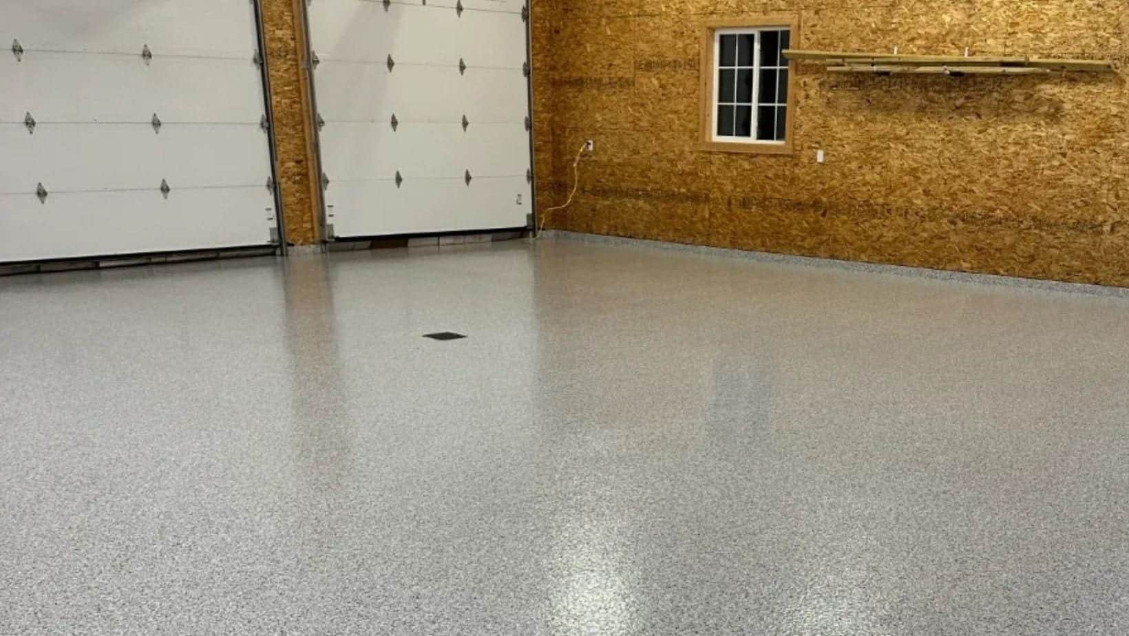 Gray flake coating across a finished working floor