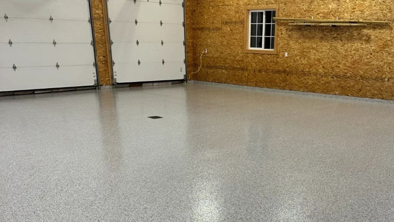 Gray flake pole barn floor completed by High Caliber in West Michigan
