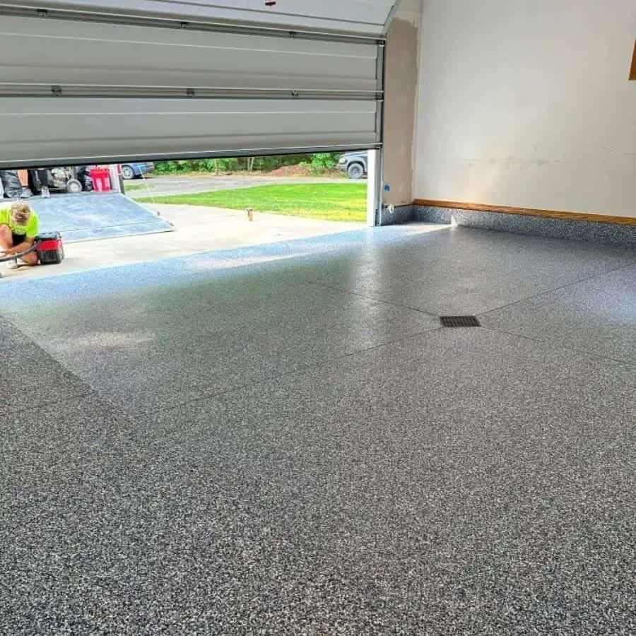 High Caliber team member reviewing a finished floor